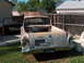 1960 Ford Ranchero - This weathered Ford Courier pickup truck, likely from 1957, sits in a grassy yard with its hood and door ajar.