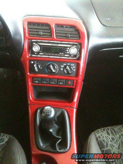 1995 Ford Probe interior dashboard with red trim, Pioneer stereo, and manual shifter
