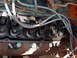 1960 Ford Ranchero - Close-up view of an engine's valve train, showing rocker arms, springs, and spark plugs.