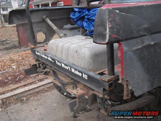 Rear of truck with large fuel tank and "Don't Follow Me... You Won't Make It!" sticker