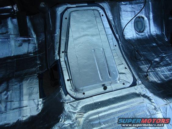 Sound deadening material installed on the floor and transmission tunnel of a vehicle