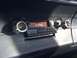 1964 Ford Ranchero - Aftermarket car radio installed in dashboard, with cigarette lighter sockets on either side.