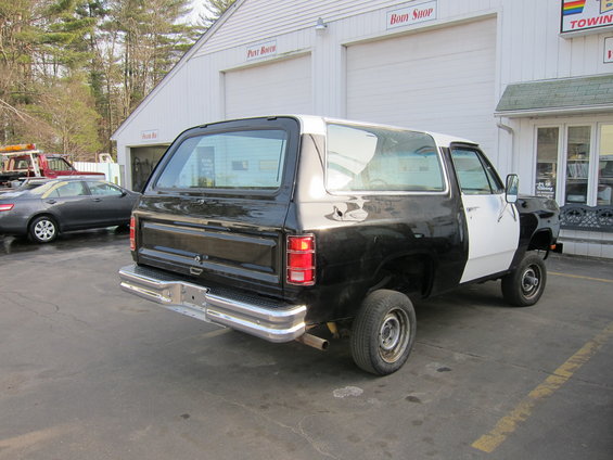 Rear view of a black and white 1987 Dodge Ramcharger SUV