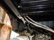 1995 Ford Bronco - The underside of a vehicle, showing the frame and fuel lines after detailing. The registry claims it is a 1995 Ford Bronco, but this is not…