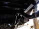 1995 Ford Bronco - Undercarriage view shows the rear suspension and exhaust system of a vehicle.