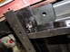 1995 Ford Bronco - Detail of a vehicle's undercarriage, showing a newly painted chassis component and hardware.