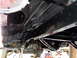 1995 Ford Bronco - The undercarriage of a vehicle is shown, with focus on the rear axle and exhaust system.