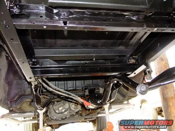 1995 Ford Bronco rear chassis underside with clean black paint and visible drivetrain components