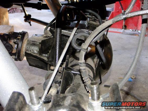 Rear differential and suspension components with Supermotors.net logo