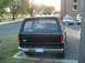 1985 Ford Bronco - Rear view of a 1985 Ford Bronco parked in a lot, showing the Ford logo and license plate.