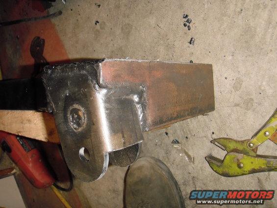 Welded metal bracket with a hole for a bolt