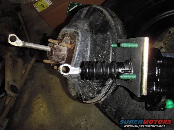 Brake booster and master cylinder assembly with pushrod and mounting bolts
