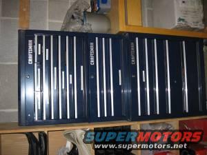 Three dark blue Craftsman tool chests with silver handles, side-by-side