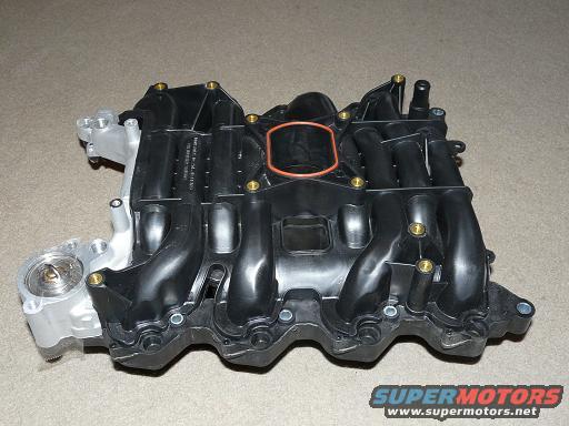 Ford intake manifold with visible part numbers and a red gasket ring