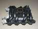1999 Ford Crown Victoria - This is a Ford intake manifold, likely for a V8 engine, with part numbers visible.