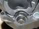 1999 Ford Crown Victoria - Close-up of a damaged plastic intake manifold part, showing cracks and wear.