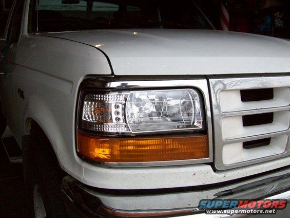White Ford F-150 front end with chrome grille and amber turn signal