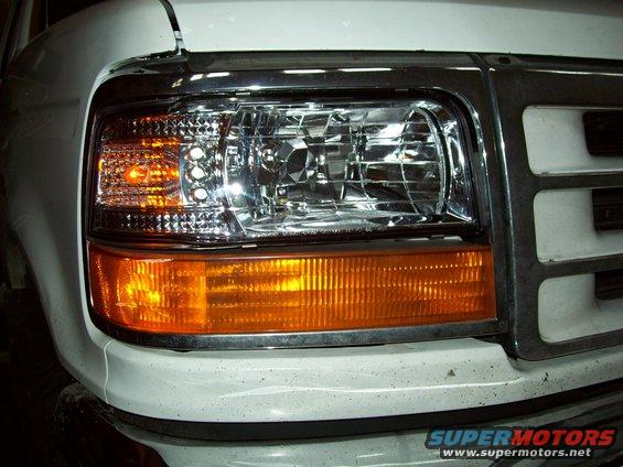 Close-up of 1992 Ford F-150 headlight assembly and chrome grille