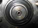 1987 Polaris Indy 600 - Close-up of a wheel bearing with "UB205 JAPAN" visible, indicating its origin and part number.