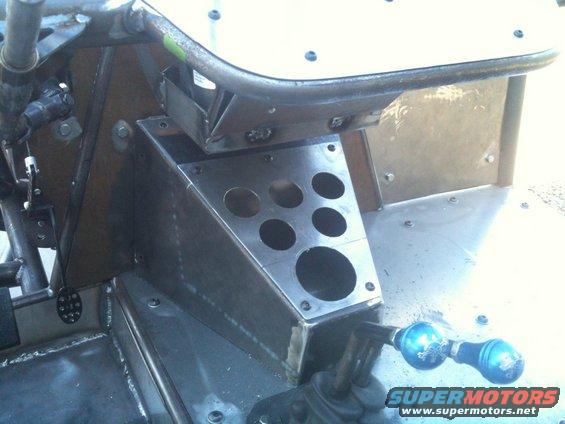 Custom metal interior with dual blue shift knobs and a gauge panel