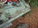 1993 Ford Bronco - A driveshaft and carburetor are visible on a table outdoors.