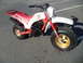 1994 Jeep Cherokee - This Yamaha three-wheeled motorcycle has a white body, red seat, and gold rims.