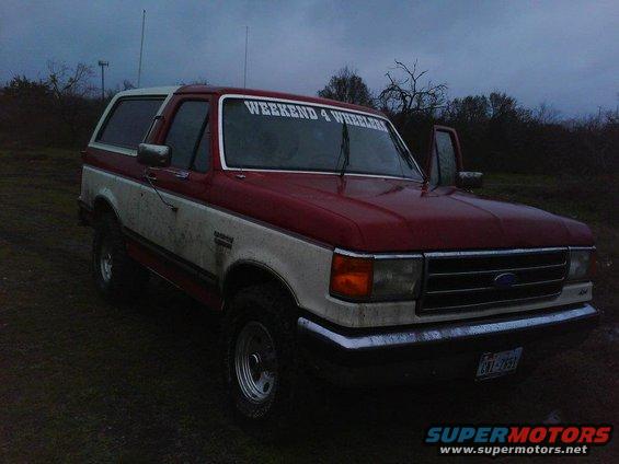 Red and white 1989 Ford Bronco with "WEEKEND 4 WHEELERS" decal
