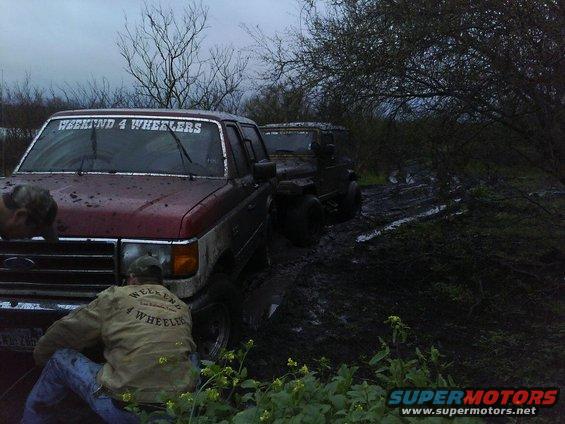 1989 Ford Bronco front end in mud, windshield banner reads WEEKEND 4 WHEELERS
