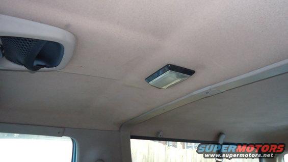 Interior ceiling view showing an air vent and a dome light