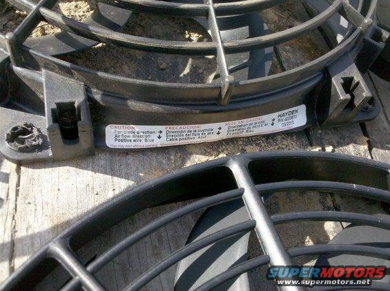 Two black electric cooling fans with caution labels. One label reads HAYDEN PIN 400870 03/2010