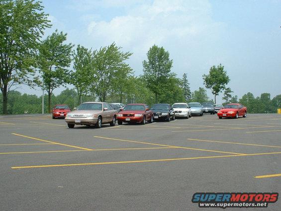 Gold 2000 Ford Crown Victoria parked in a lot, front 3/4 view