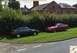 2003 Mercury Marauder - Two cars, a red Ford Mustang Cobra and a black Toyota Celica, are parked on a grassy area.
