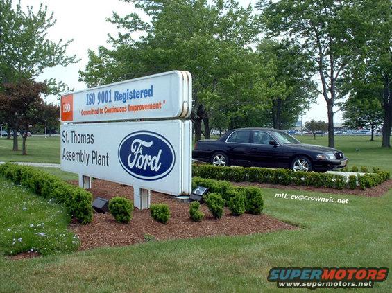 Black 2000 Ford Crown Victoria parked by the St. Thomas Assembly Plant sign