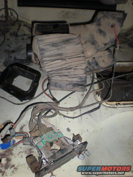 Dusty HVAC blower motor housing and control assembly with wiring