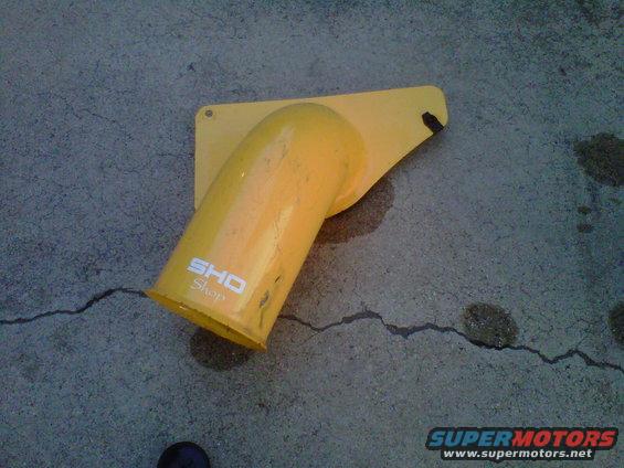 Yellow SHO Shop intake part on concrete