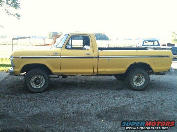 Yellow 1978 Ford F-250 pickup truck, side view