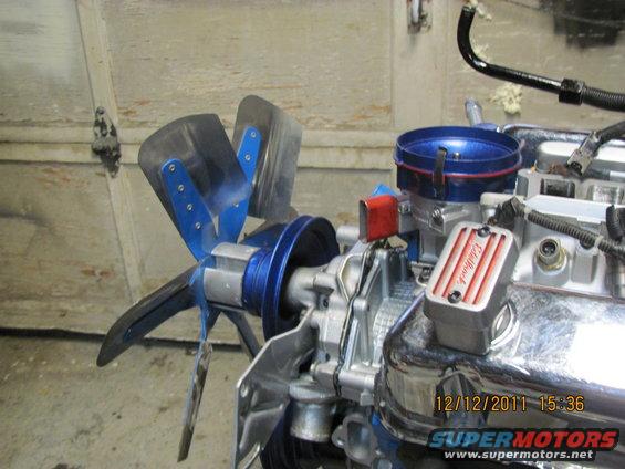 Engine with blue fan shroud and red-striped Edelbrock air cleaner