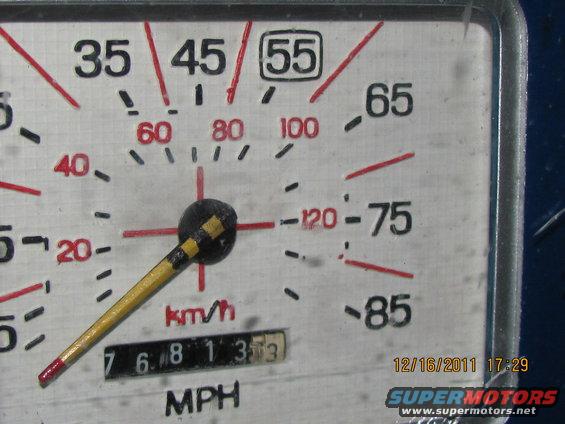 Speedometer gauge with needle pointing to 35 mph, odometer shows 76813. Date stamp 12/16/2011