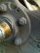 1995 Ford Bronco - This photo shows a close-up view of a vehicle's hub assembly, including bolts and a bearing.