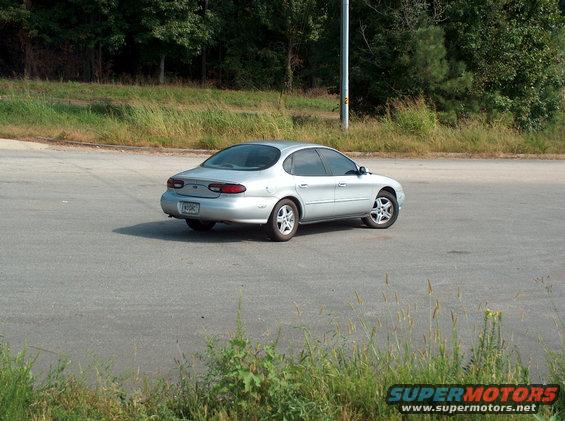 Silver 1998 Ford Taurus from rear quarter view
