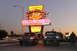 1994 Ford Bronco - Two trucks are parked in front of Angelo's Hamburgers, a diner with a large neon sign.