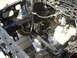 1987 Ford Mustang - Close-up of a car's chassis, showing engine bay components and wiring harness.