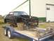 1987 Ford Mustang - This 1987 Ford Mustang is being transported on a trailer, stripped down for project work.