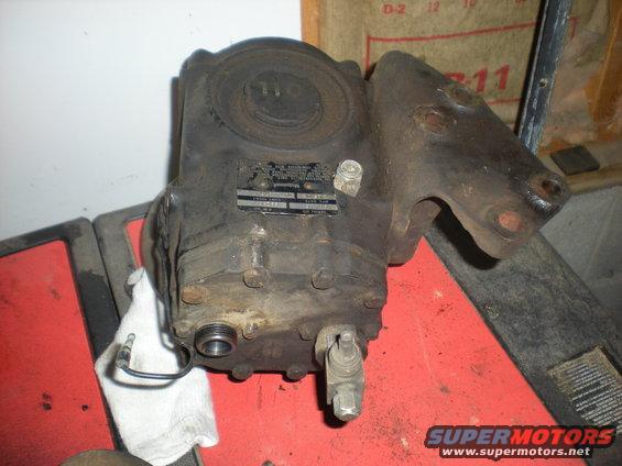 Black metal part with a label and wires
