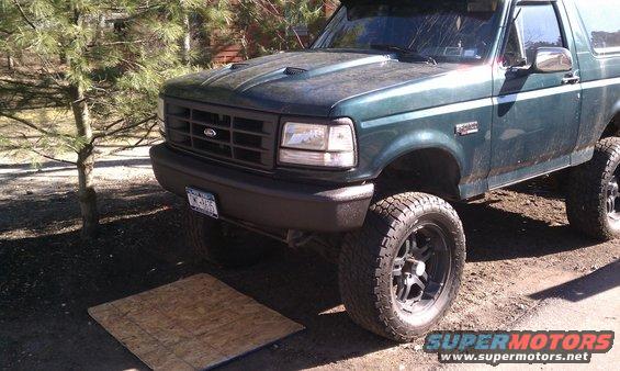 Green 1992 Ford Bronco front 3/4 view with aftermarket wheels
