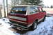 1990 Ford Bronco - This red Ford Bronco with a tan top is parked outside in a snowy environment.