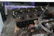 1990 Ford Bronco - A disassembled engine block with visible spark plugs and wiring harness, suggesting it is a component rather than a complete vehicle.
