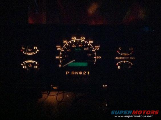 img_00541.jpg When your done, put it all back together. This is it lit up. Not all of the Bulbs are lit(hooked up to a 9V). If you want a color, you can paint the white with transparent glass paint in any color you want and it will show through. I plan on doing this to my actual cluster, only with white LED's to make them a bright white. This cluster is for sale. ~$45. We can negotiate. PM if interested. It all works, and the PSOM read 286,000mi.