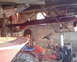 1972 Champion 181 SX - A red tractor is parked inside a garage with a red steel beam overhead.