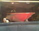 1972 Champion 181 SX - The angular red hull of a boat is visible inside a cluttered garage.